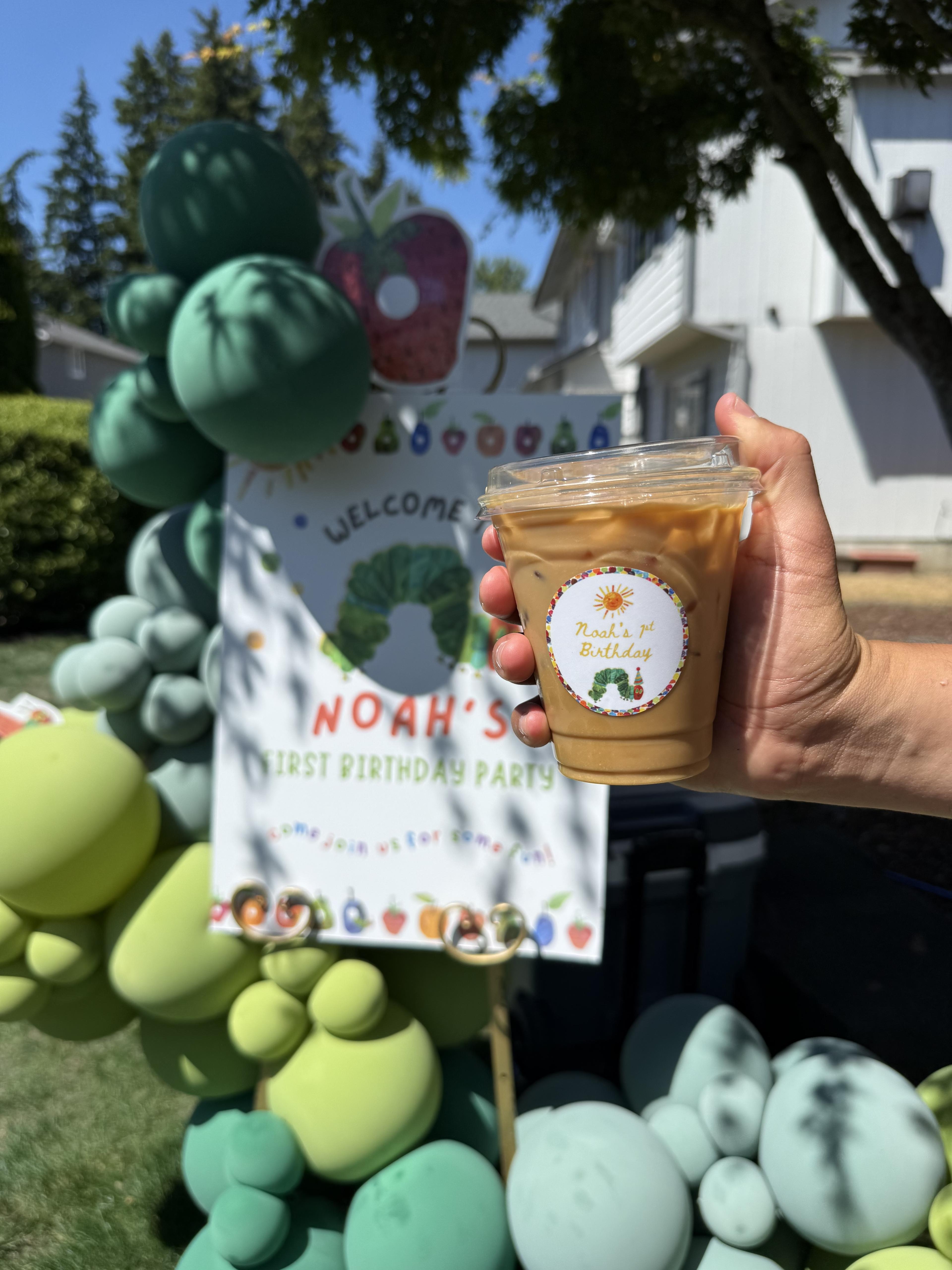 An iced coffee with a Noah’s first birthday label at a private party